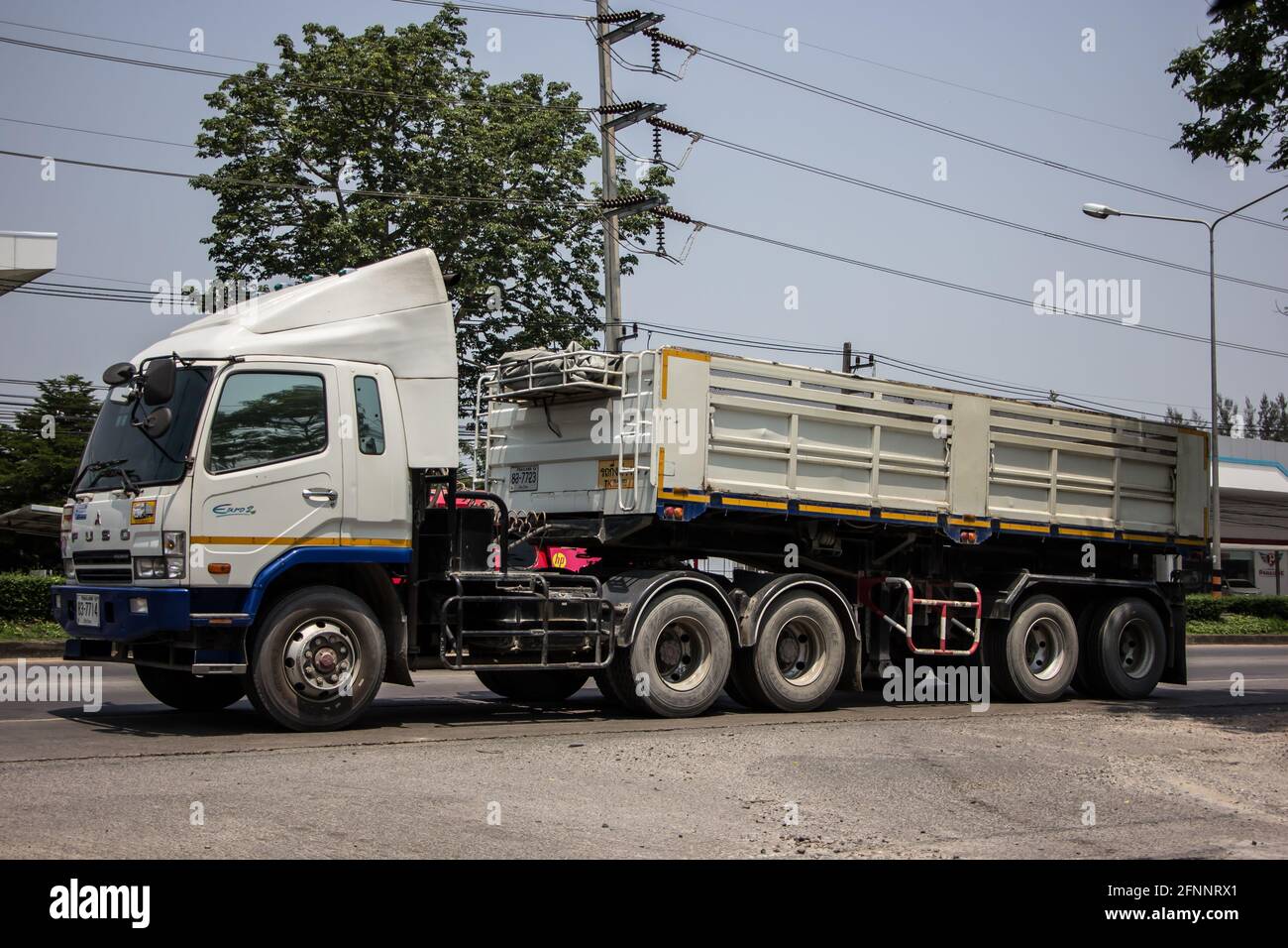 Chiangmai, Thailand - March  21 2021: Private Mitsubishi Fuso Dump Truck.  Photo at road no.121 about 8 km from downtown Chiangmai, thailand. Stock Photo