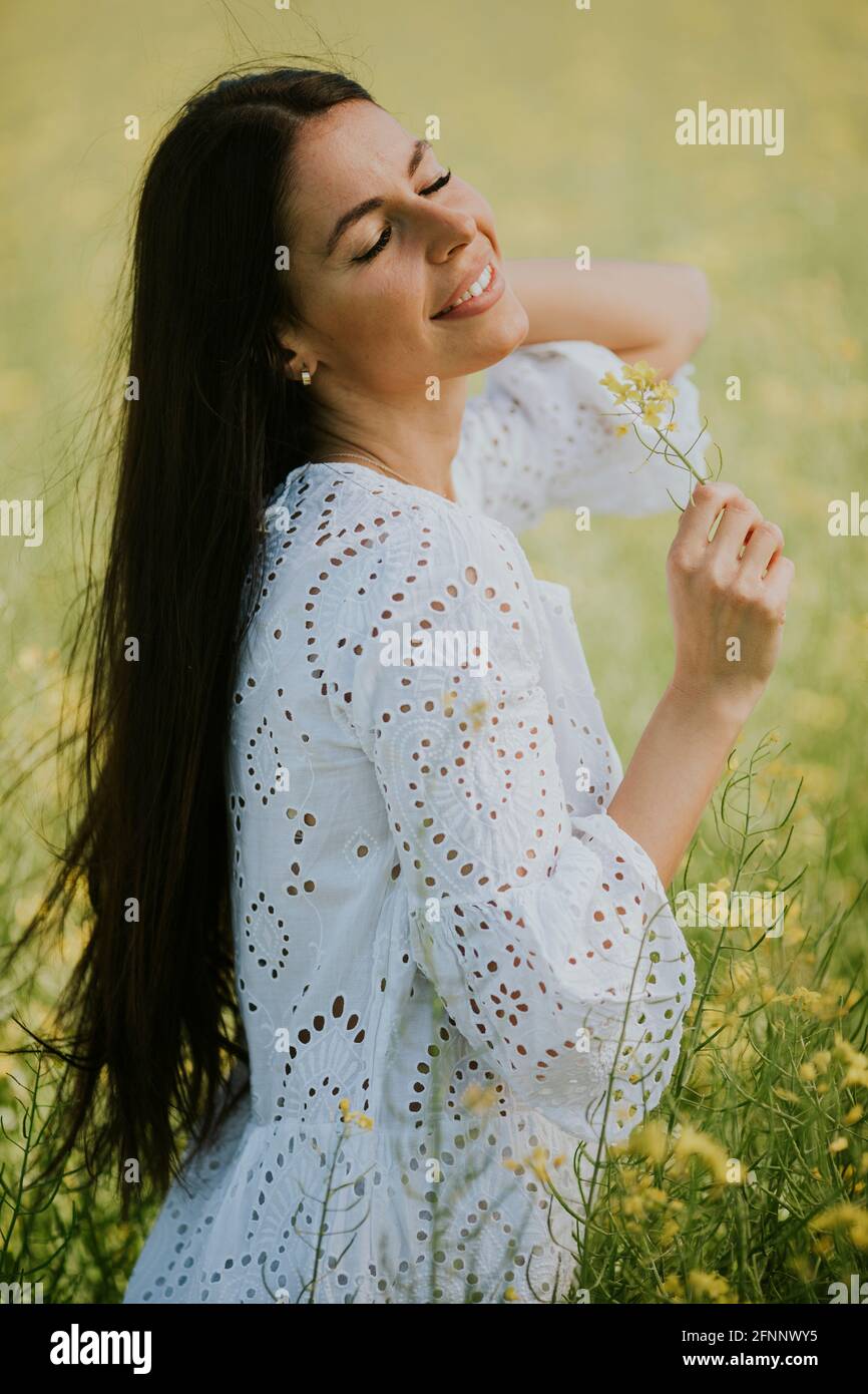 Young happy woman in yellow hi-res stock photography and images - Alamy