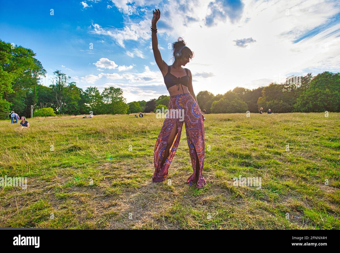 GREAT BRITAIN / England / London / Hampstead Heath / Ecstatic Dance London event . Dancers wearing wireless silent disco headphones. Stock Photo