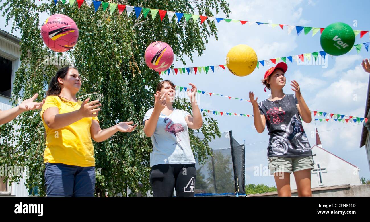 Odesa rgn. Ukraine, August 6, 2018 Girls, simultaneously throwing the