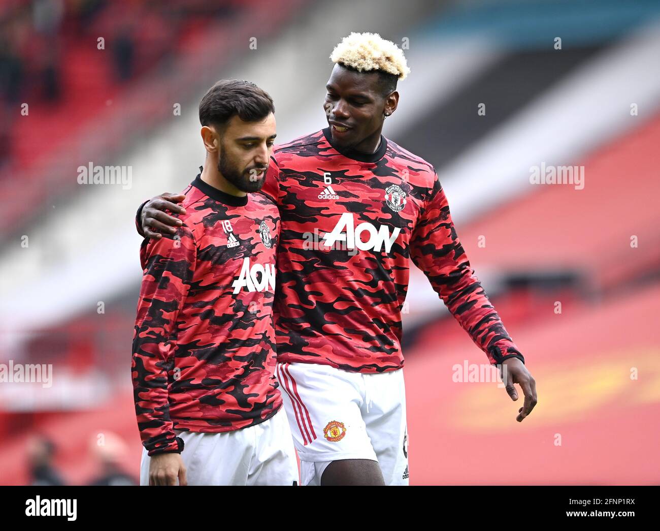 Manchester United's Paul Pogba (right) and Manchester United's Bruno Fernandes prior to the Premier League match at Old Trafford, Manchester. Picture date: Tuesday May 18, 2021. Stock Photo