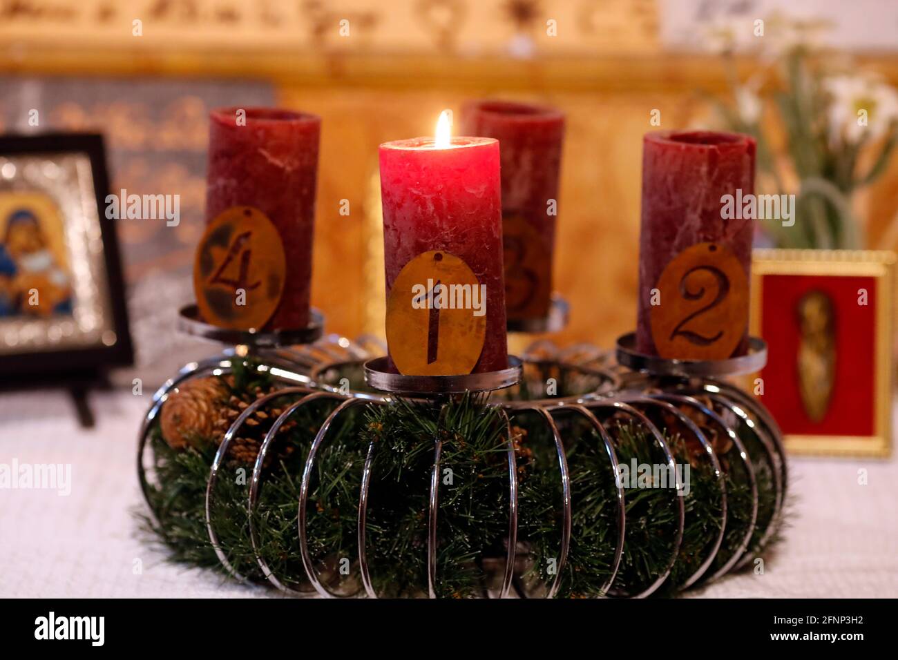 Natural advent wreath or crown in a catholic church with one burning