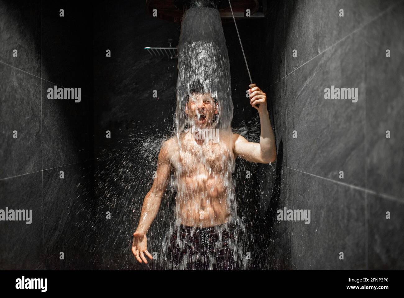Outdoor shower and cold water bucket in a spa Stock Photo - Alamy