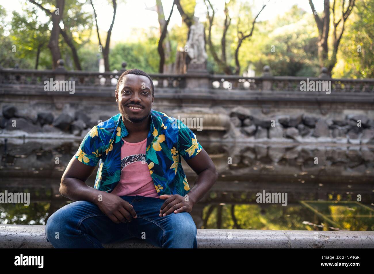 A young black man in park. Outdoor portrait of traveler. Portrait Stock ...