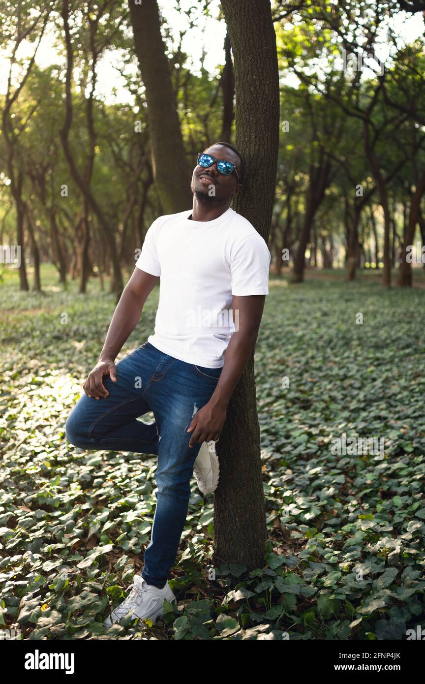 A young black man in park. Outdoor portrait of traveler. Portrait Stock ...