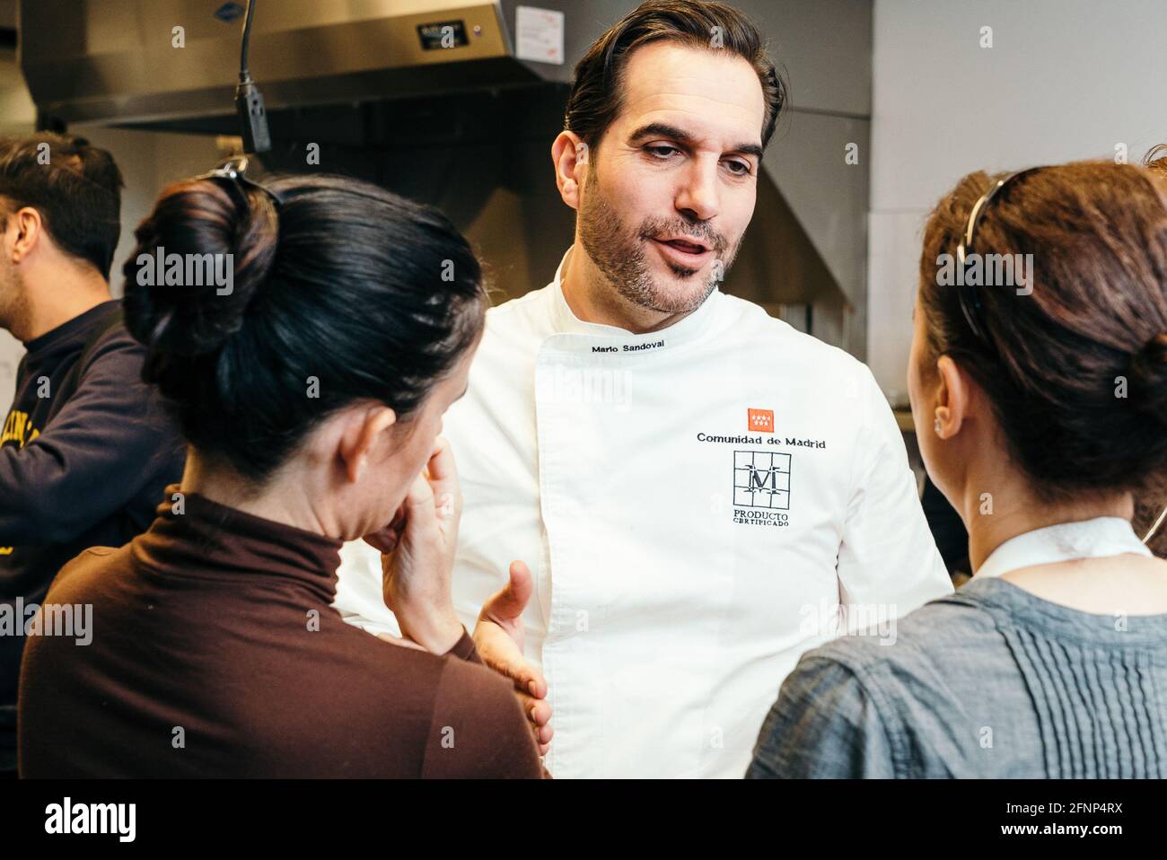 A Journey into Spain’s Food and Culture - Suckling Pig Master Class Led by Chef Mario Sandoval, at the Kitchen Classroom of ICE Stock Photo