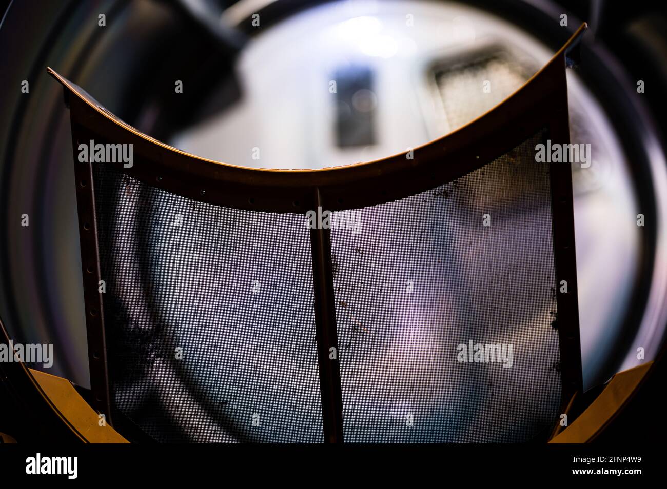 Dryer lint trap pulled to remove buildup after each cycle Stock Photo
