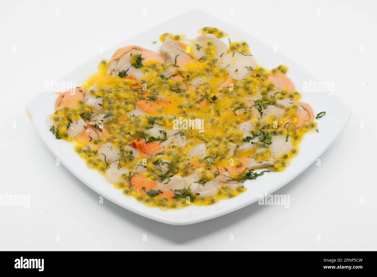 Vietnamese food. Scallop carpaccio with passion fruit.   France. Stock Photo