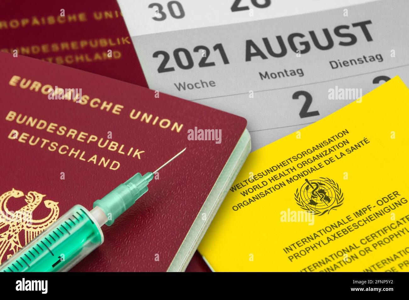 German Passport and Vaccination Certificate August 2021 Stock Photo