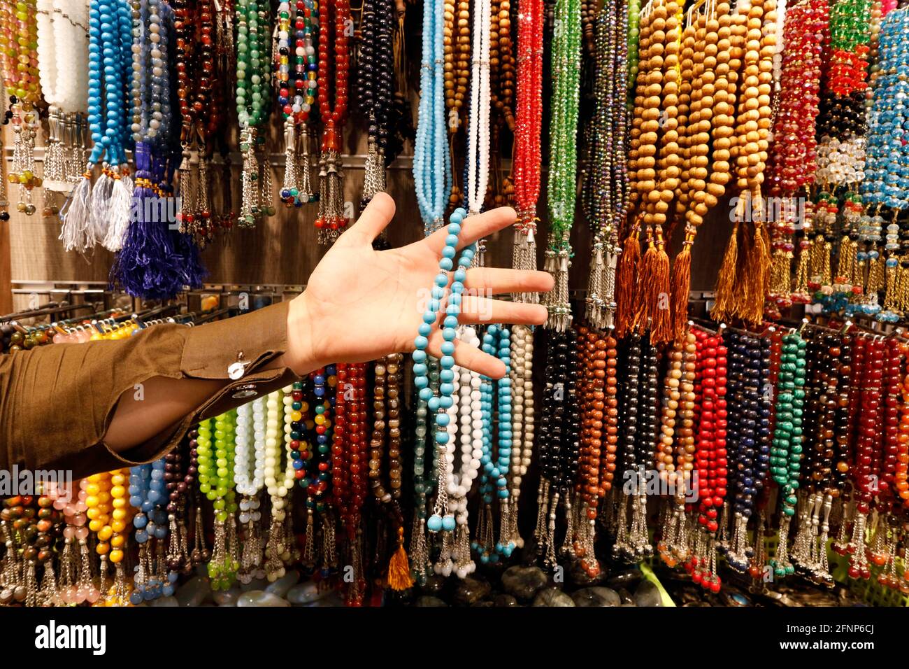 Muslim prayer beads ( tesbih ) in different patterns and colors.  Dubai. United Arab Emirates Stock Photo