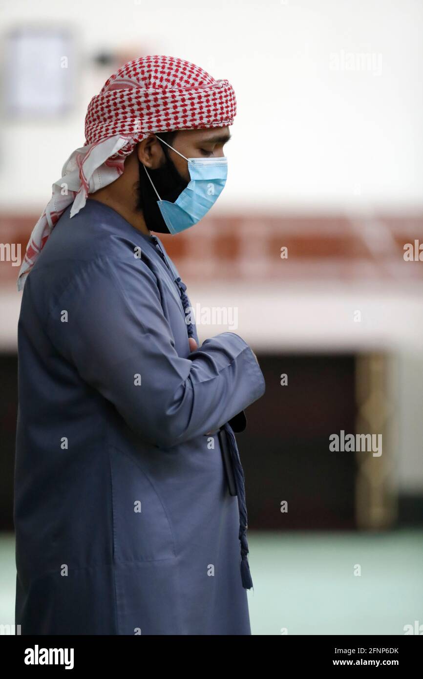 The Jumeirah Mosque. Muslim performing salah during Covid-19 pandemic.  Dubai. United Arab Emirates Stock Photo