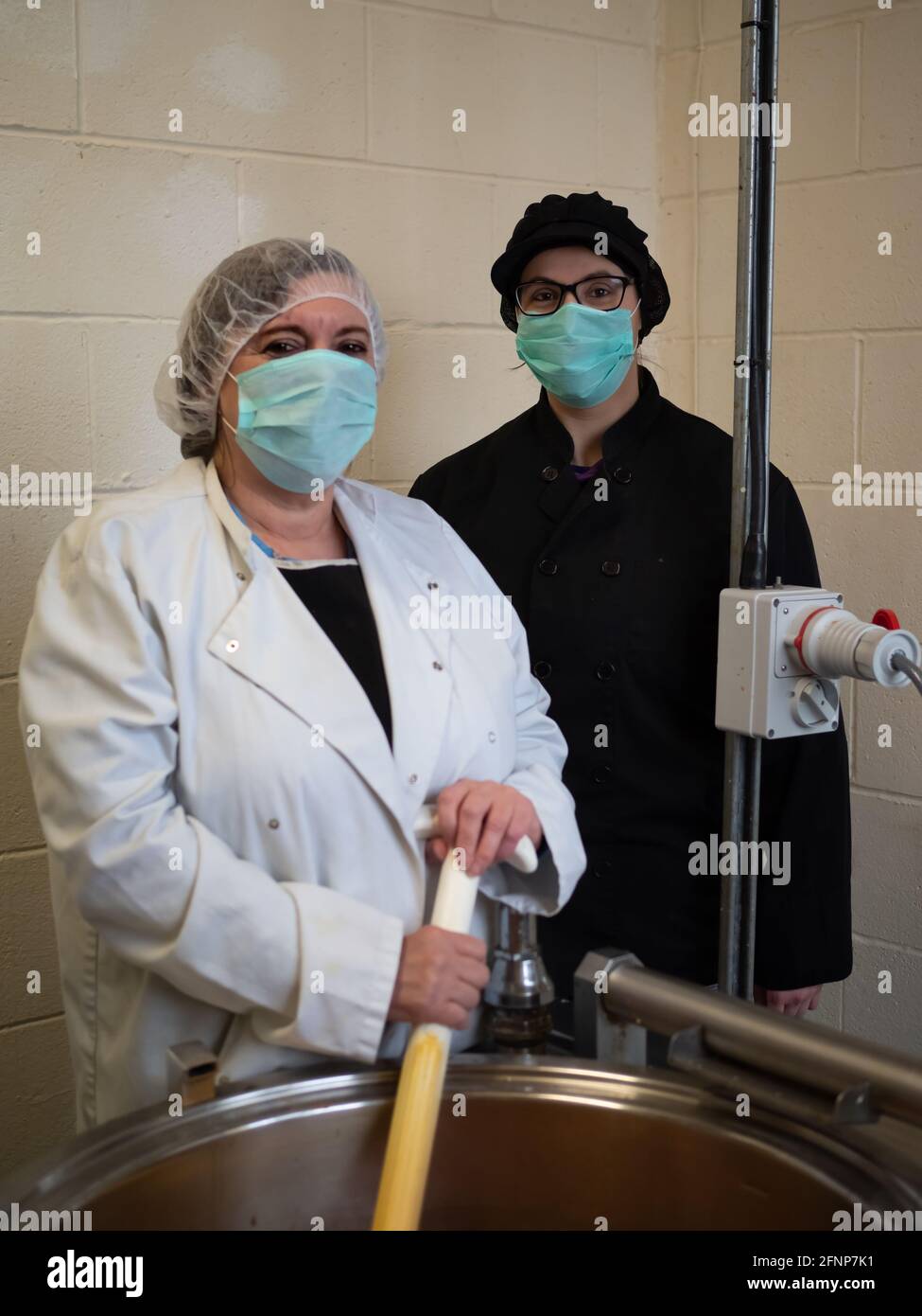 two food production factory workers Stock Photo