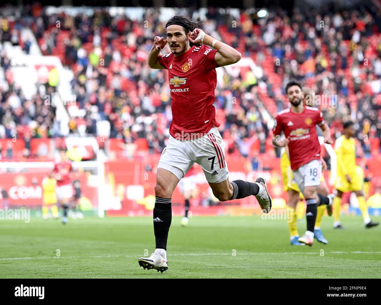 Manchester United's Edinson Cavani celebrates scoring their side's first goal of the game during the Premier League match at Old Trafford, Manchester. Picture date: Tuesday May 18, 2021. Stock Photo