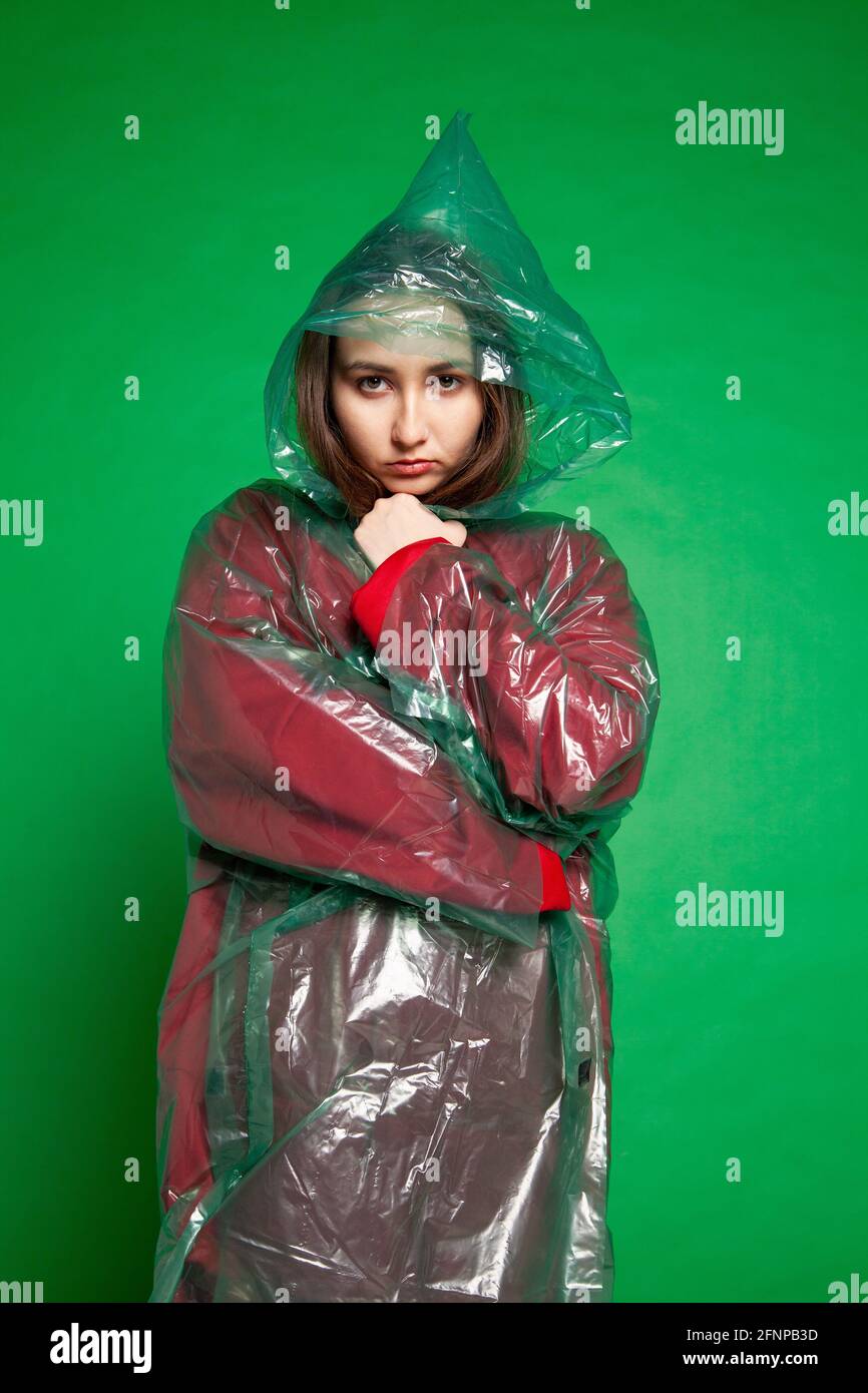 Woman wearing plastic raincoat hi-res stock photography and images - Alamy