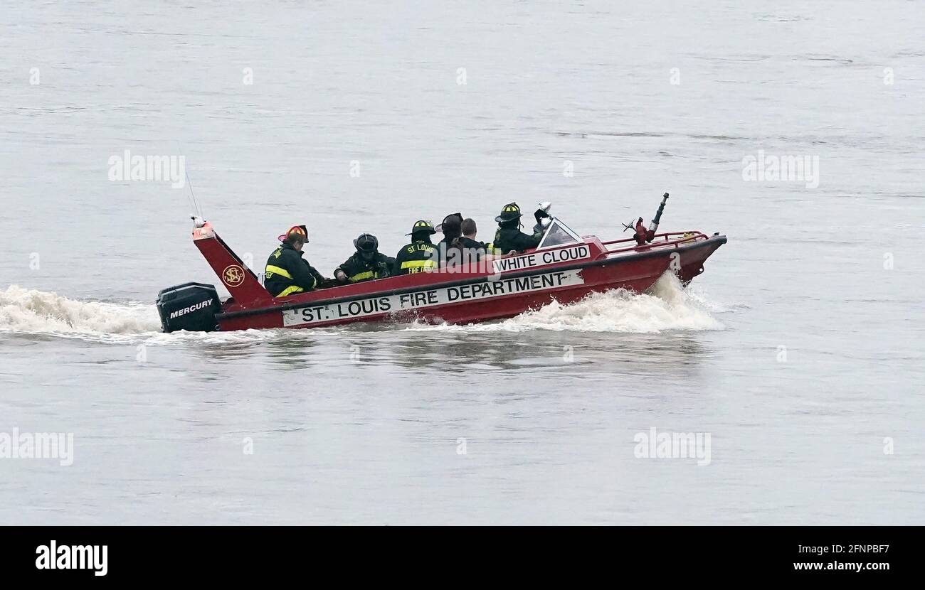 St. Louis, United States. 18th May, 2021. St. Louis firefighters use a marine unit to ferry to a fire aboard the Mary Lynn tug boat on the Mississippi River south of the St. Louis riverfront in St. Louis on Tuesday, May 18, 2021. Firefighters were able to save the vessel after a fire broke out in the engine room, spreading to the rest of the boat.Two firefighters left the scene with smoke inhalation. Photo by Bill Greenblatt/UPI Credit: UPI/Alamy Live News Stock Photo