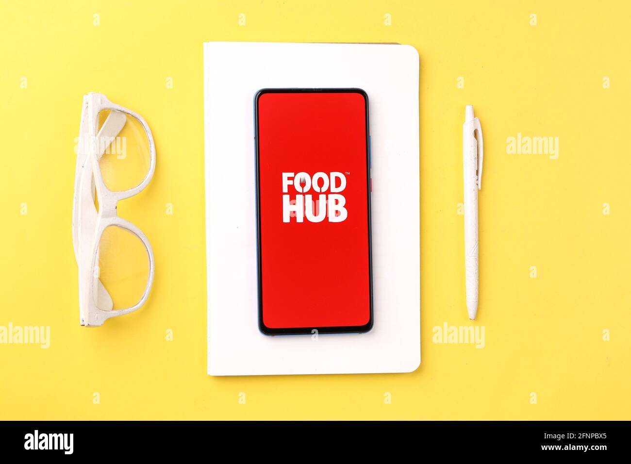 Assam, india - May 18, 2021 : Foodhub logo on phone screen stock image. Stock Photo