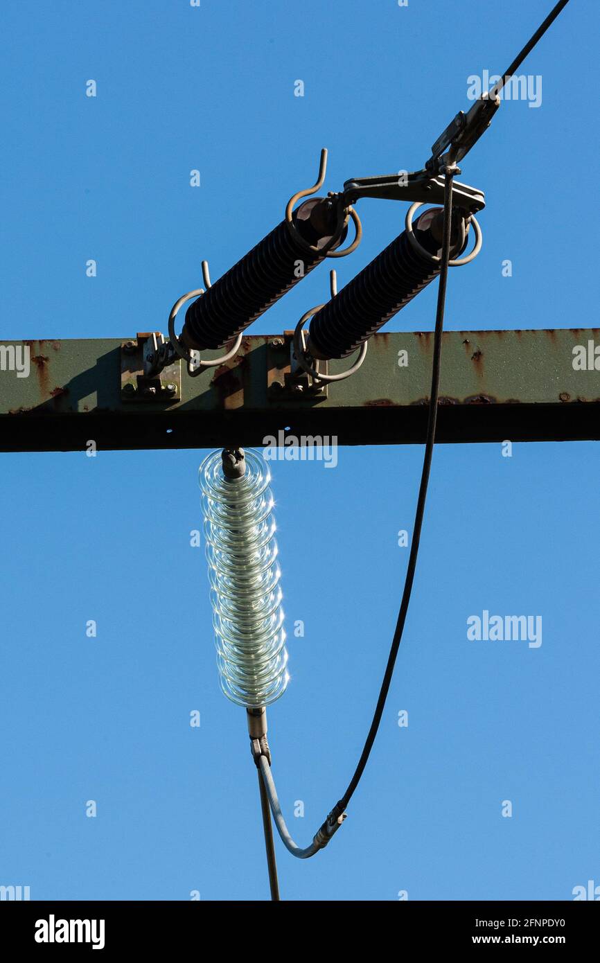Isolators against a blue sky Stock Photo