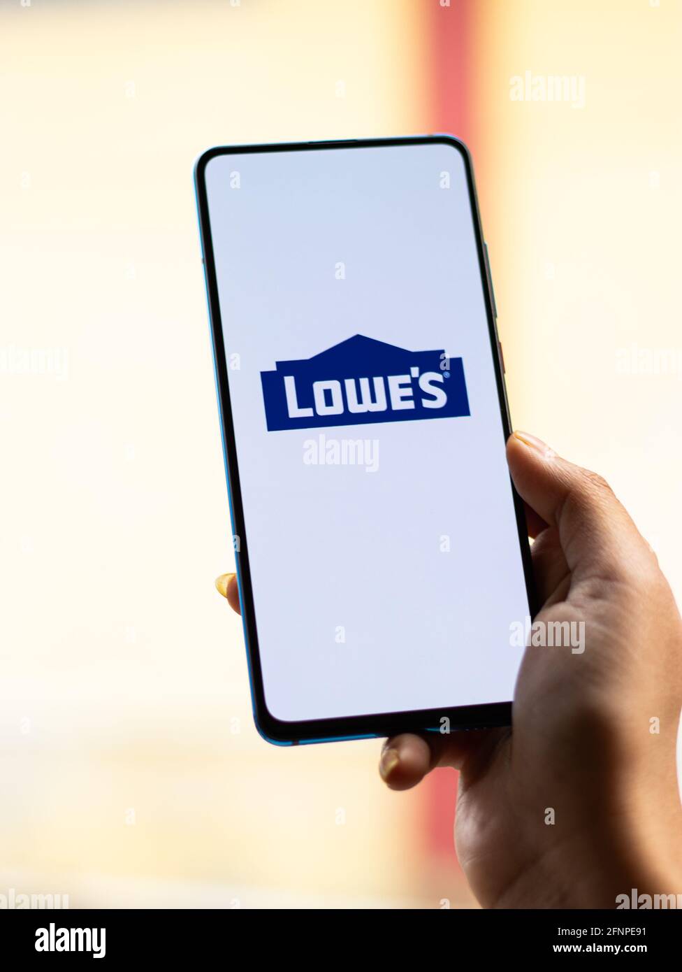 Assam, india - May 18, 2021 : Lowe's logo on phone screen stock image. Stock Photo