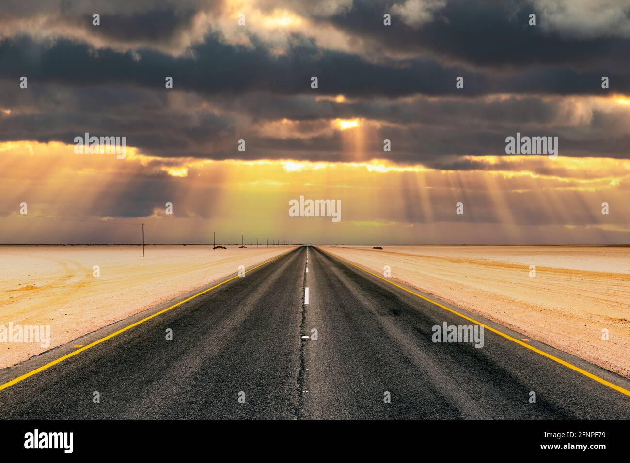 Asphalt road and beautiful landscape with sunset sky Stock Photo