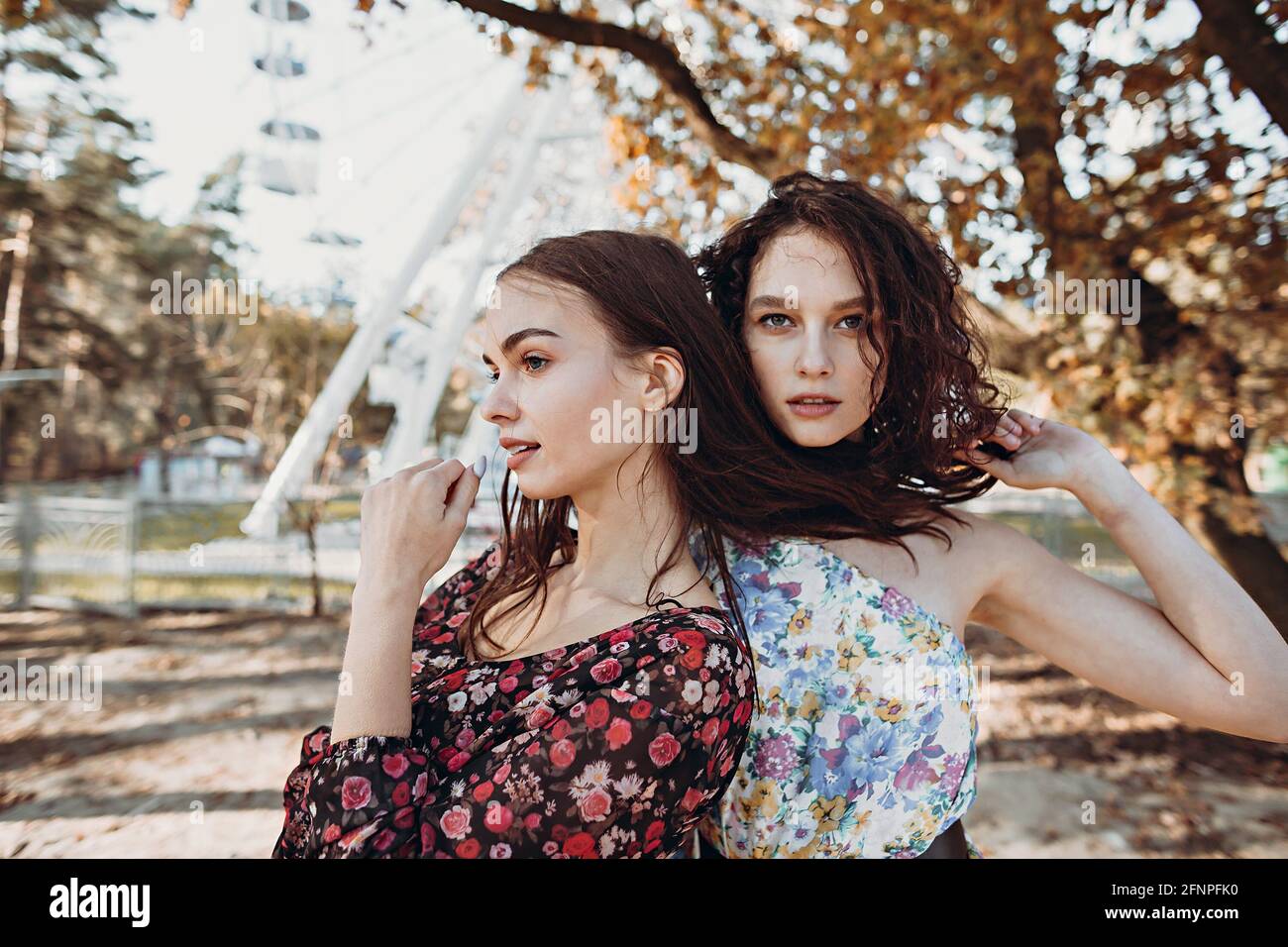 Two young women in park hi-res stock photography and images - Alamy