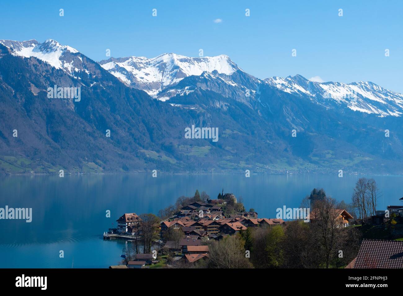 beautiful-swiss-village-iseltwald-at-lake-brienzersee-and-snow-covered