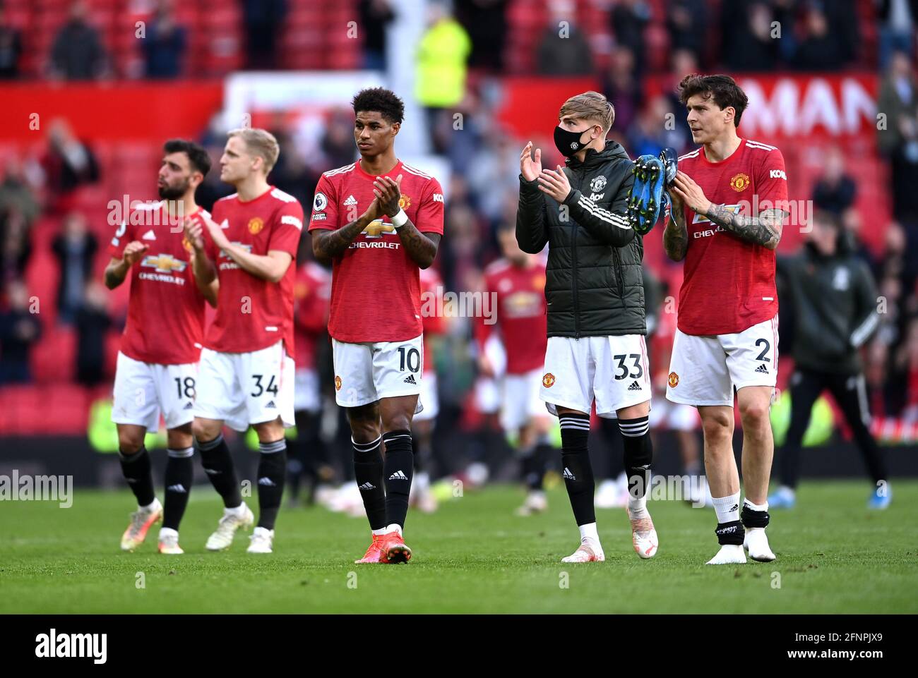 Manchester United players applaud the fans after the Premier League match at Old Trafford, Manchester. Picture date: Tuesday May 18, 2021. Stock Photo