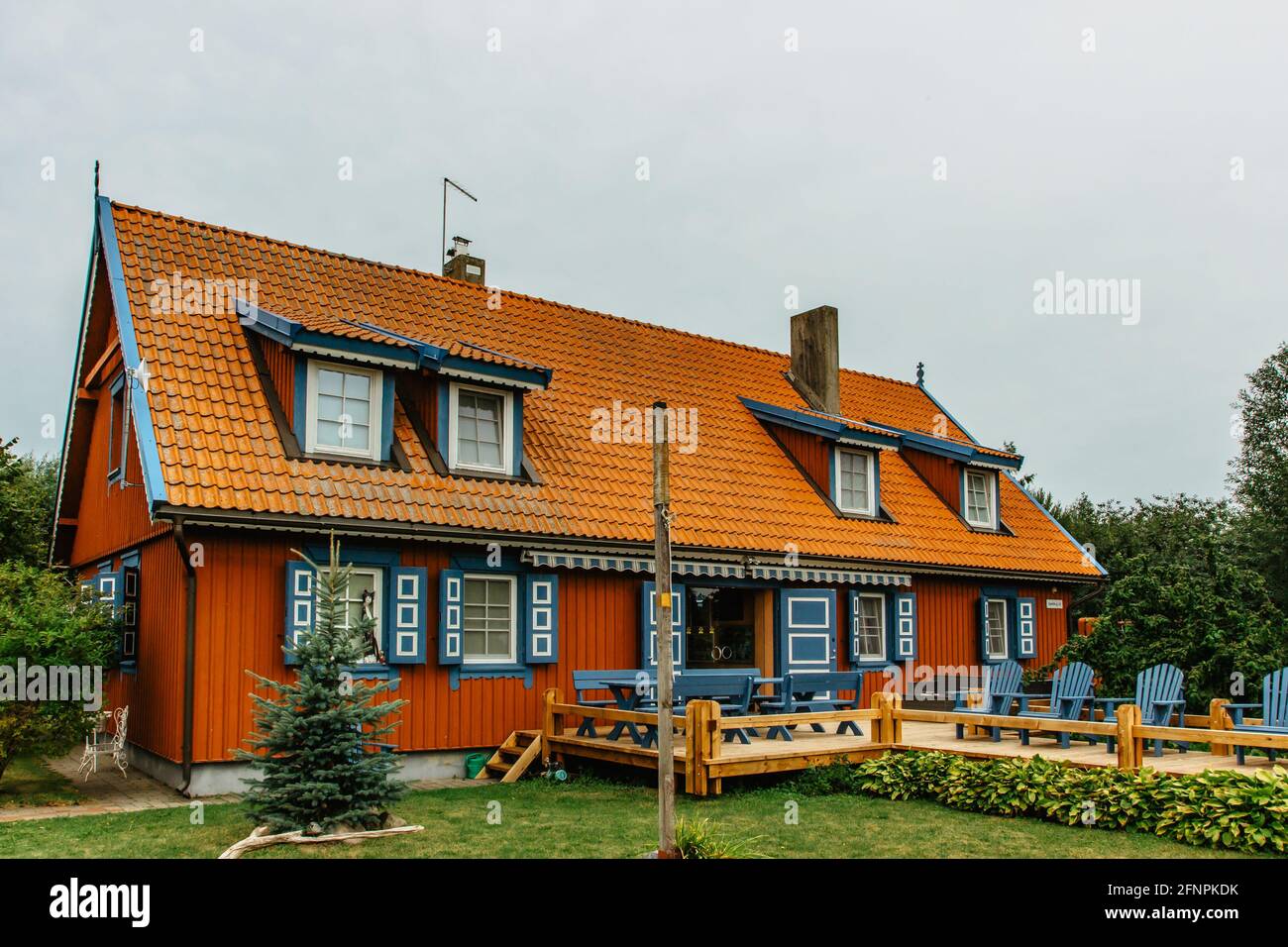 Nida,Lithuania- August 10,2019. Beautiful colorful traditional wooden architecture. Resort town on Curonian Spit. Typical fisherman's house Stock Photo