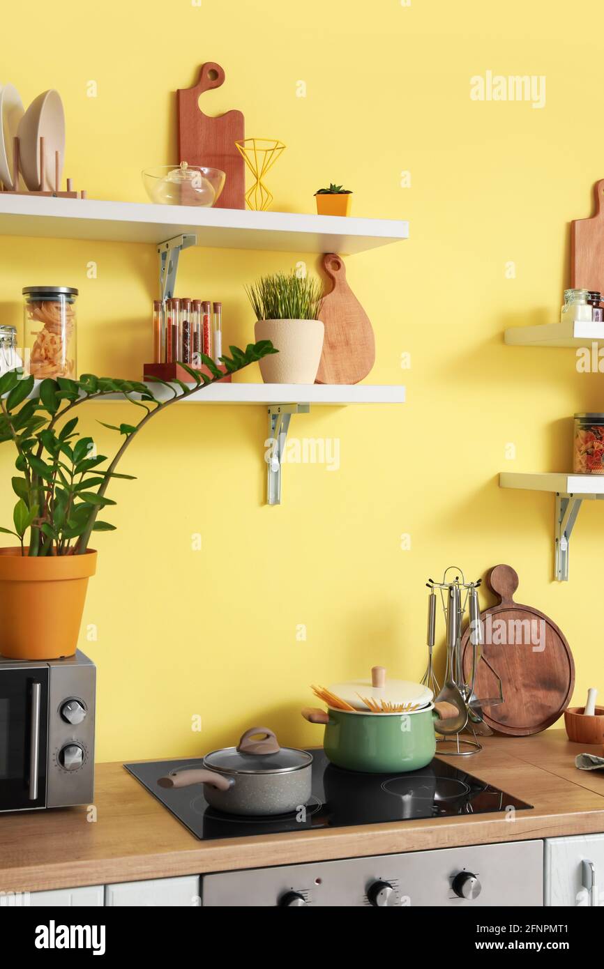 Cooking pots on electric stove in modern kitchen Stock Photo Alamy