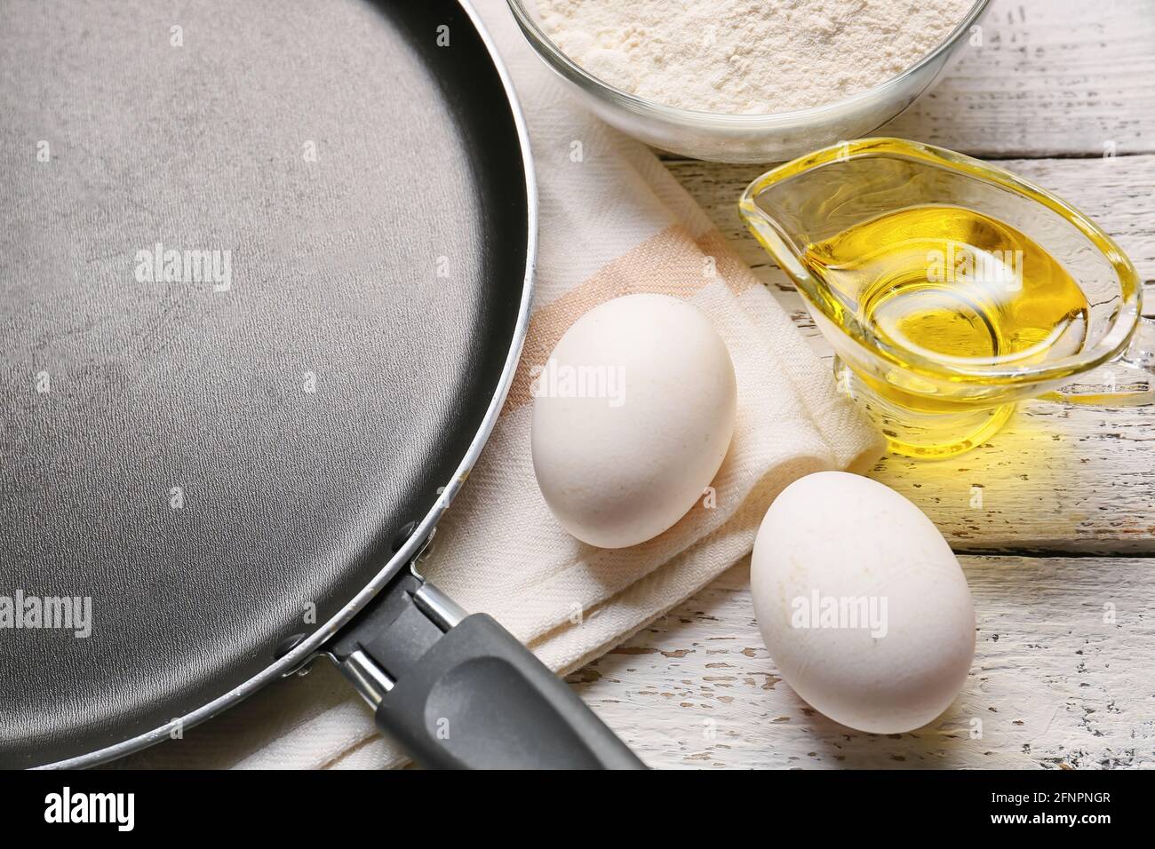 Clean frying pan with products on table Stock Photo Alamy