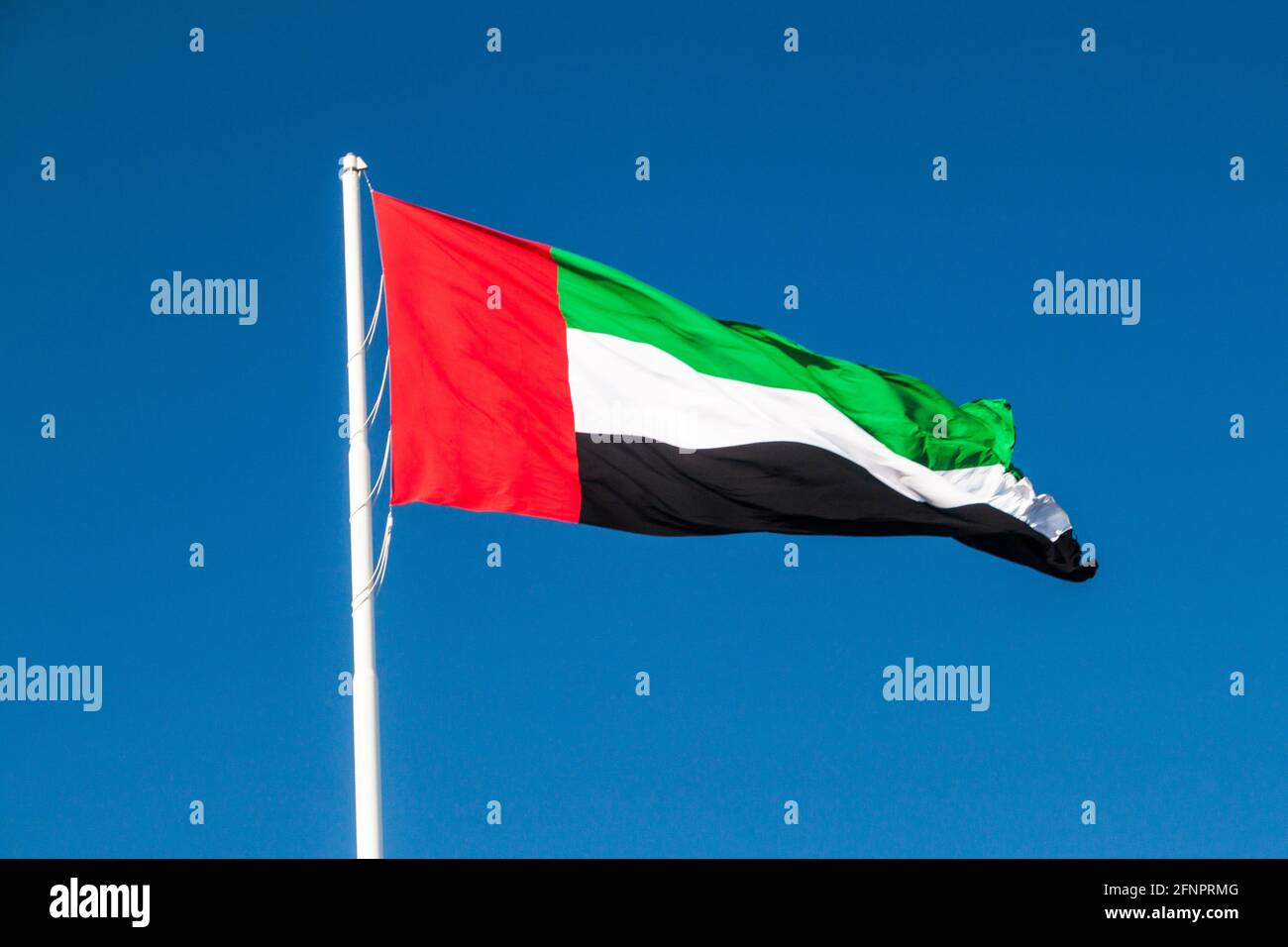 Flag on the UAE Flagpole in Abu Dhabi Stock Photo