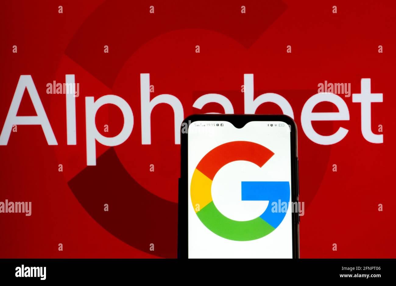 In This Photo Illustration Alphabet Inc And Google Logo Seen Displayed On A Smartphone Stock Photo Alamy