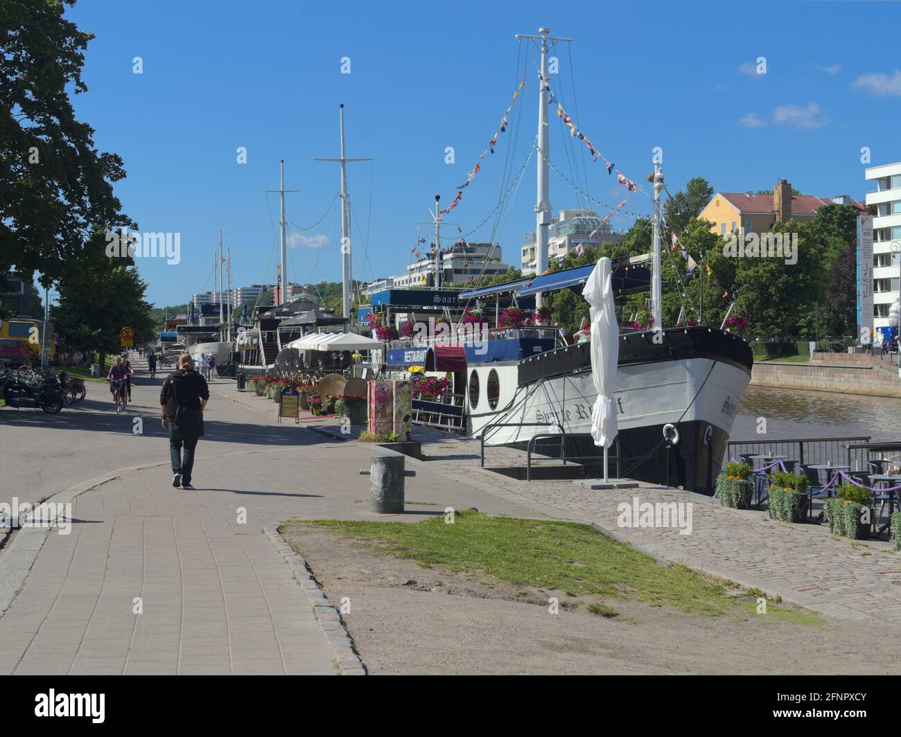 Svarte Rudolf and other restaurant ships docked in river Aura in Turku, Finland on a sunny summer day Stock Photo