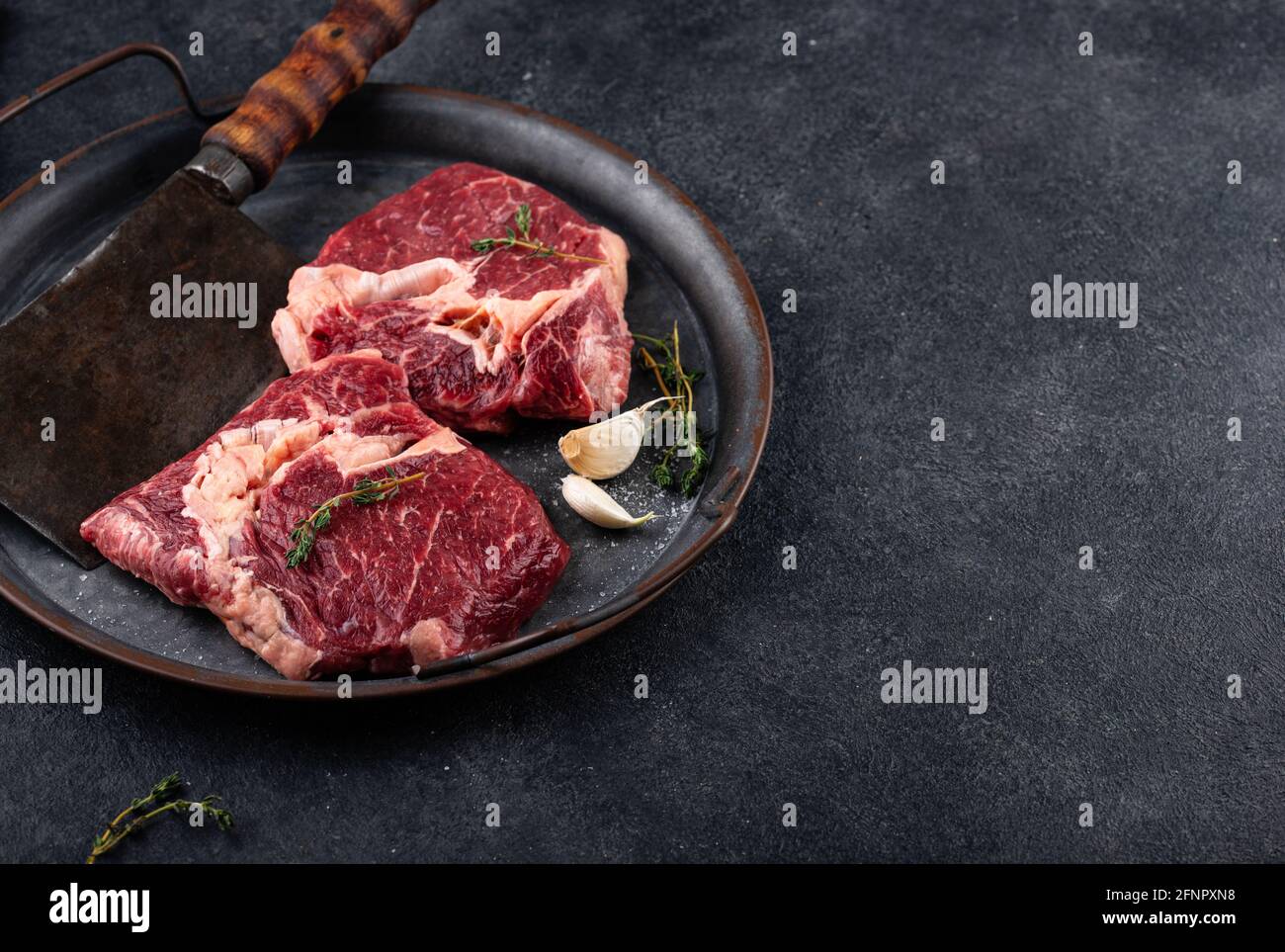 Raw uncooked rib eye steak Stock Photo Alamy