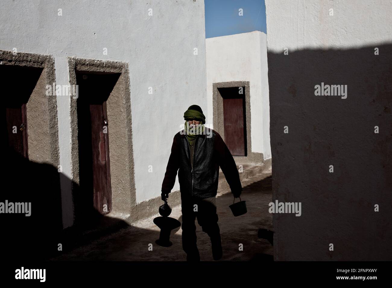 Tifariti, Liberated Territories, Western Sahara. A soldier of the Sahrawi Army with the utensils to prepare the tea. Stock Photo