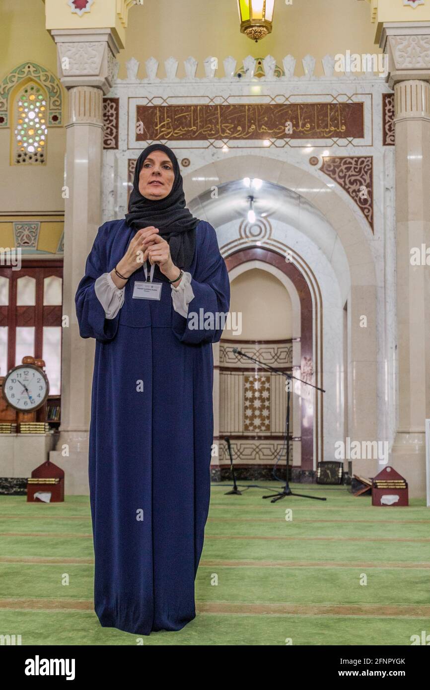 DUBAI, UAE MARCH 12, 2017 Tour guide in Jumeirah Mosque in Dubai