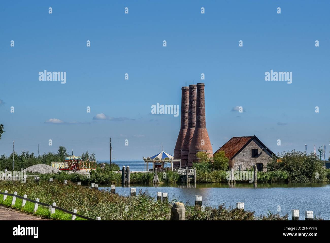 Enkhuizen, the Netherlands - September 2020. The Zuiderzeemuseum; an open air museum at the shore of the IJsselmeer with traditional Dutch fishermen cottages and flat bottomed fishing boats. High quality photo. Stock Photo