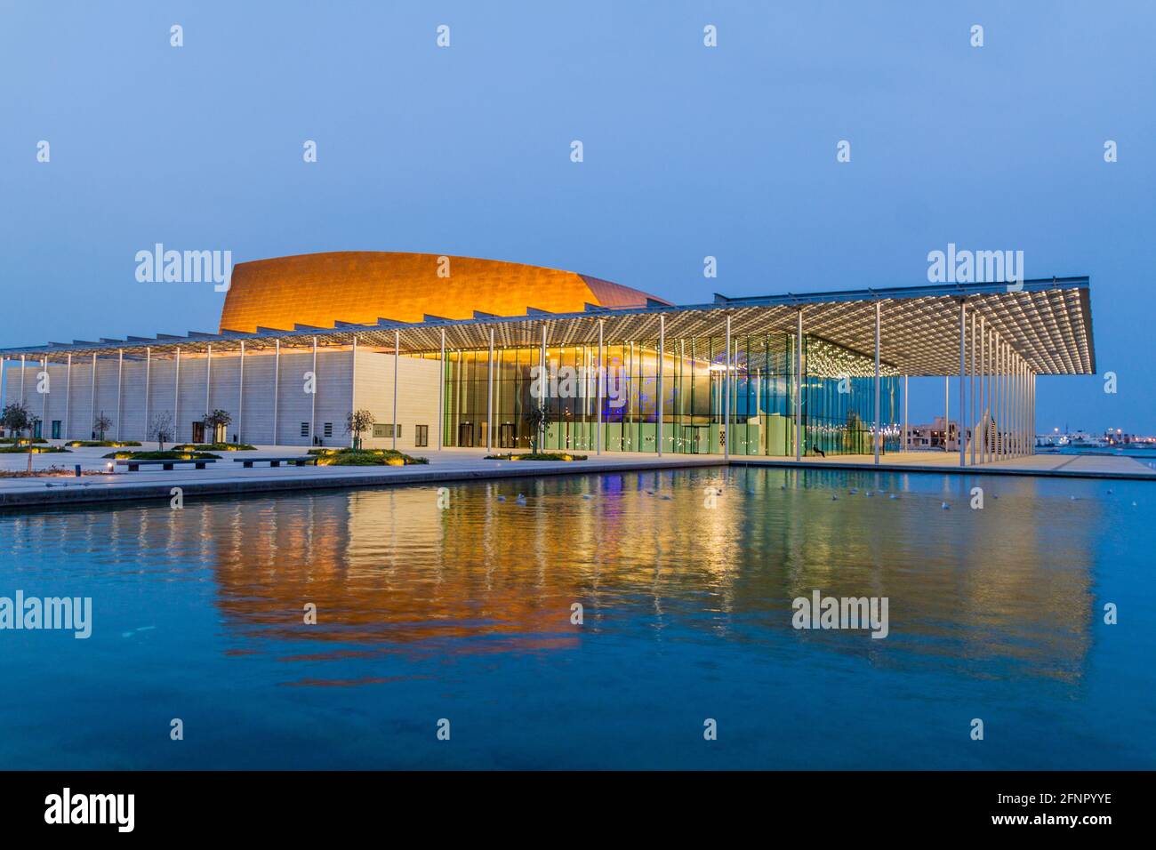 MANAMA, BAHRAIN - MARCH 15, 2017: National Theatre of Bahrain reflecting in a pond. Stock Photo