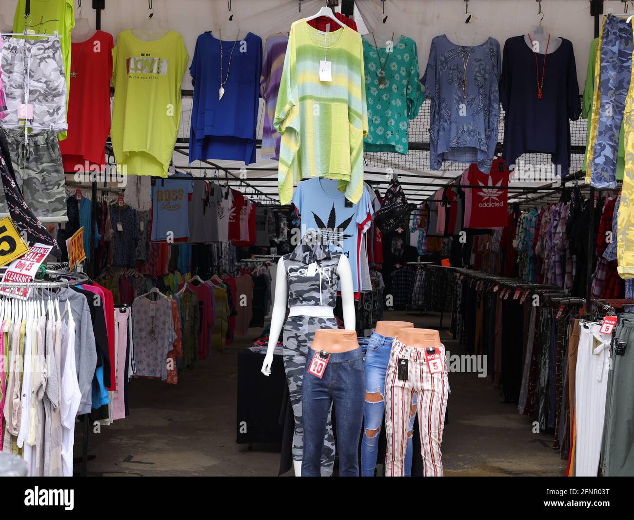 Clothes for sale on the high street, UK Stock Photo Alamy