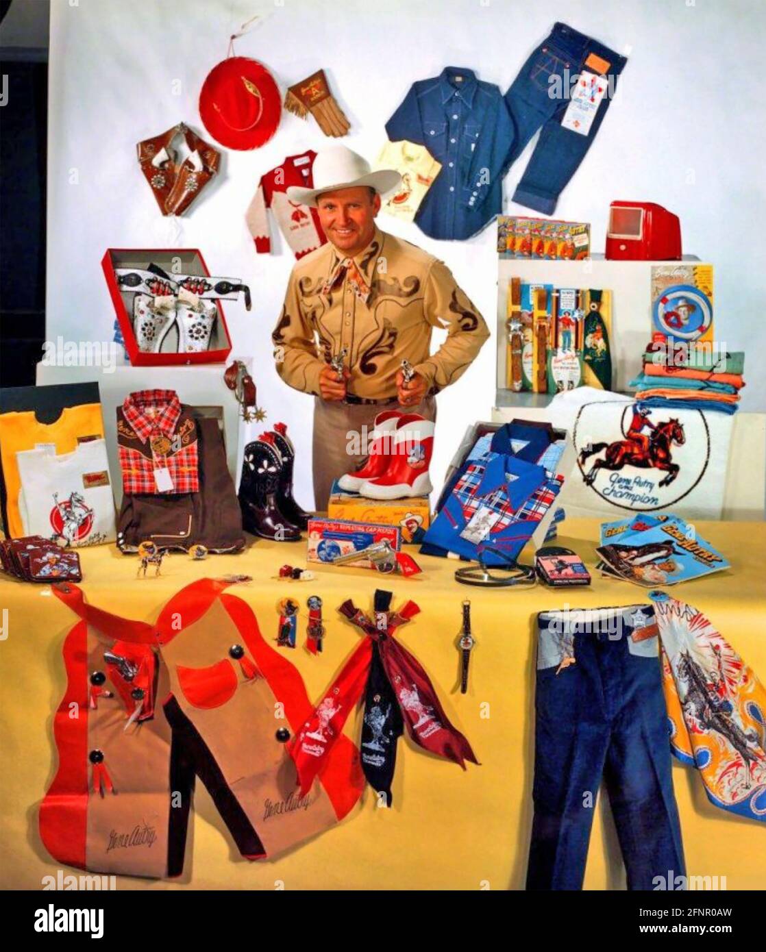 GENE AUTRY (1907-1998) American film actor and singer about 1945 with some of his merchandise Stock Photo