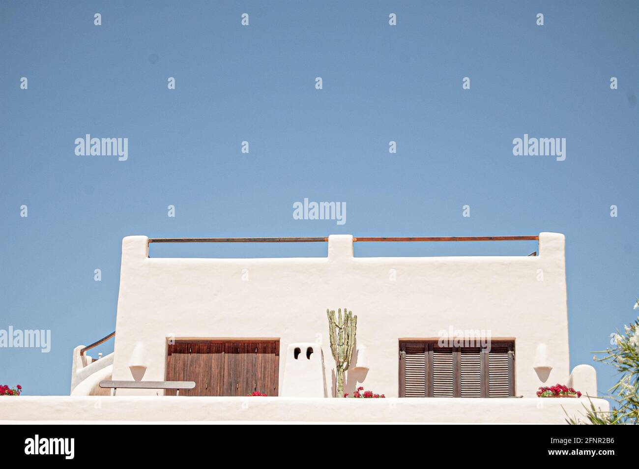 Building with a modern exterior and blue sky background Stock Photo - Alamy