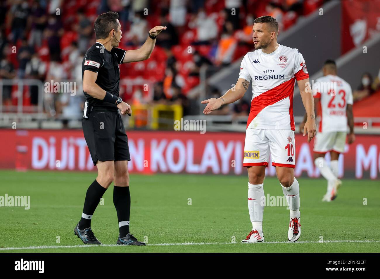 IZMIR, TURKEY - MAY 18: Referee Ali Palabıyık and Lukas Podolski of  Antalyaspor during the Turkiye Kupasa