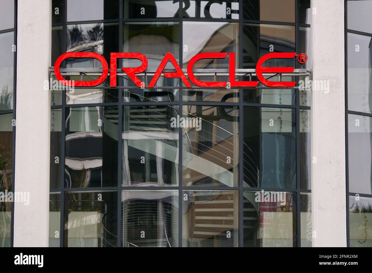 Dättwil, Aargau, Switzerland - 18th April 2021 : Oracle corporation sign hanging on a building entrance in Switzerland. Oracle Corporation is an Ameri Stock Photo