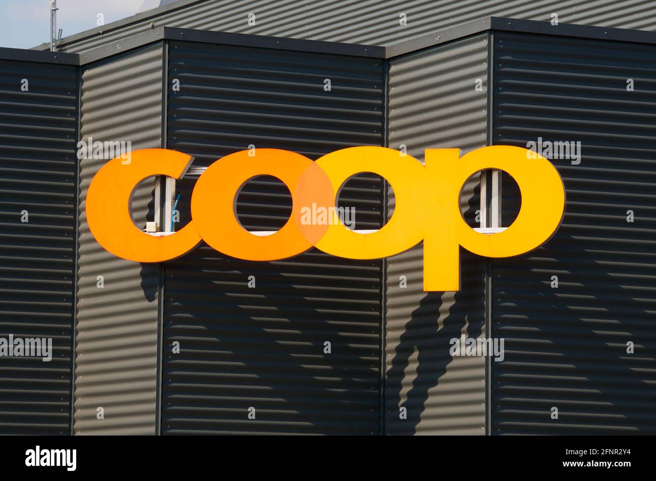 Dietlikon, Zurich, Switzerland - 16th April 2021 : Coop logo sign on a store building in Dietlikon. The Coop Group is one of Switzerland's largest ret Stock Photo