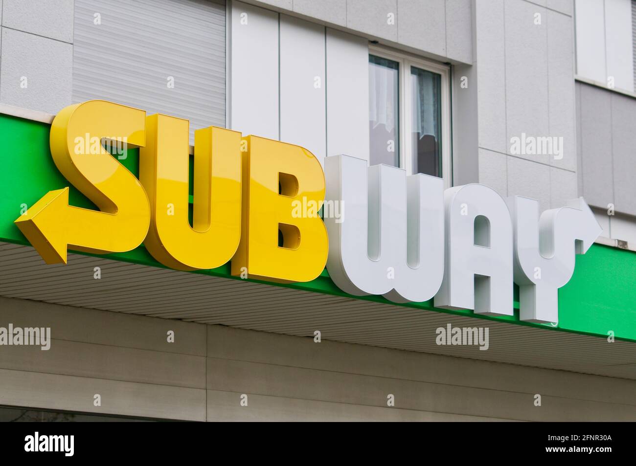 Wohlen, Aargau, Switzerland - 18th April 2021 : Subway store sign hanging in front of a shop in Wohlen. Subway is an American privately held restauran Stock Photo