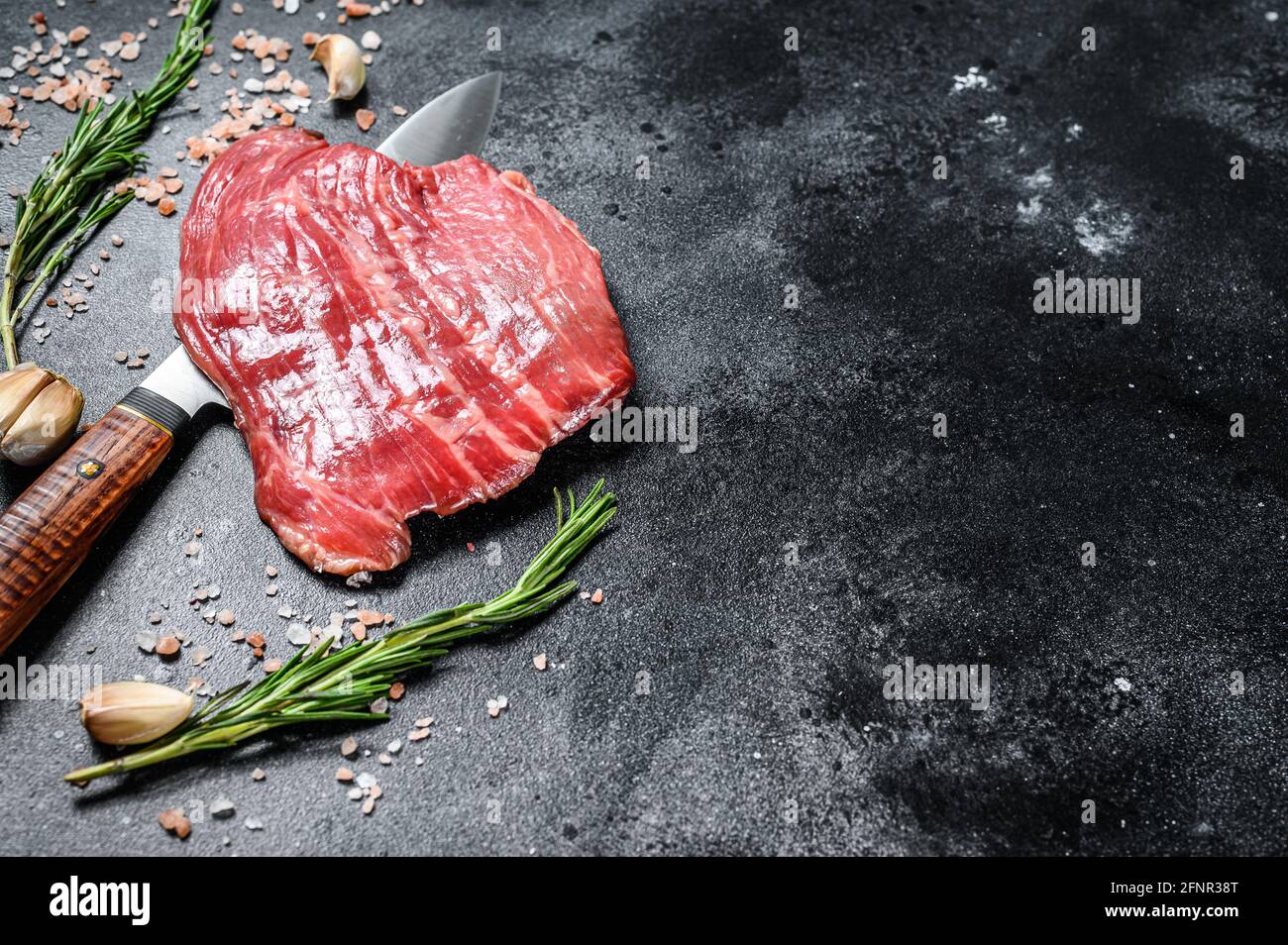 Raw Flat Iron steak black Angus. Fresh Marble beef meat. Black