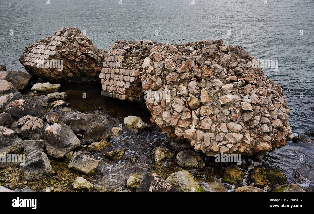 wall ruins along the coast, Gaeta, Italy Stock Photo