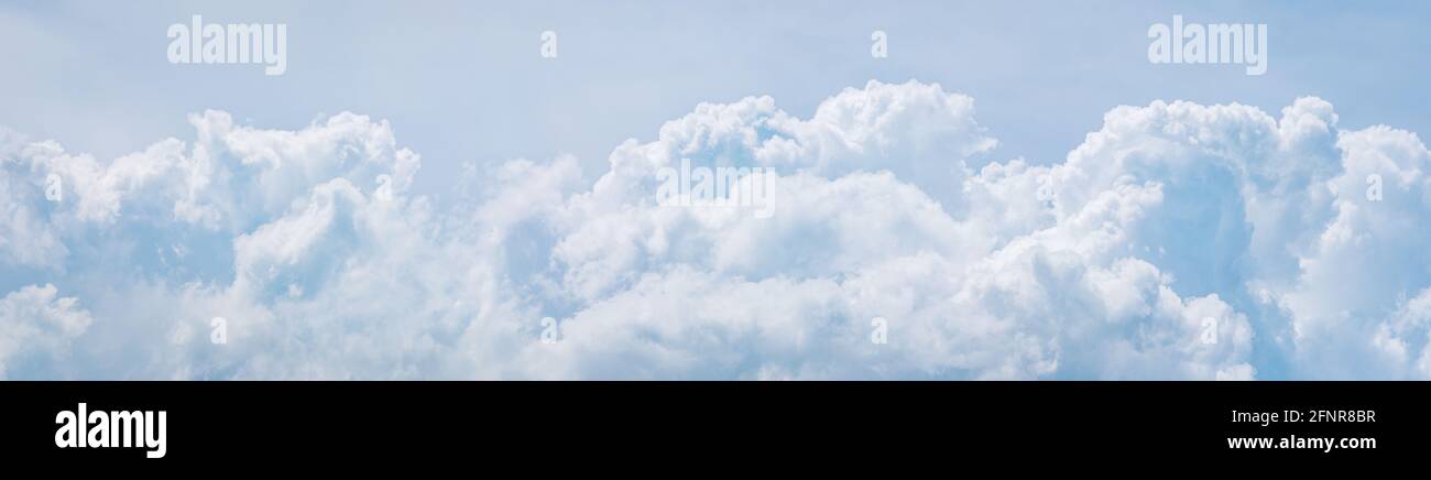 Light blue cumulus clouds texture, wide summer sky background Stock Photo