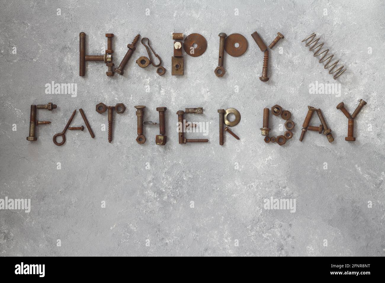 Word Father Day made of rusty hand tools which lie on a stone background Stock Photo