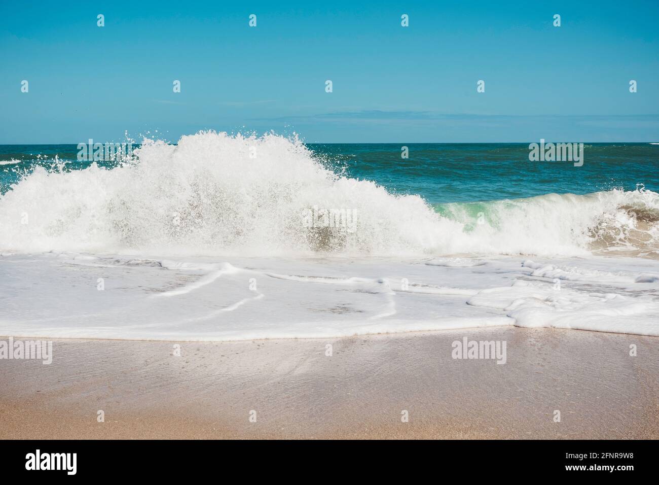 Waves crashing on the shore of Sebastian Inlet in Florida Stock Photo