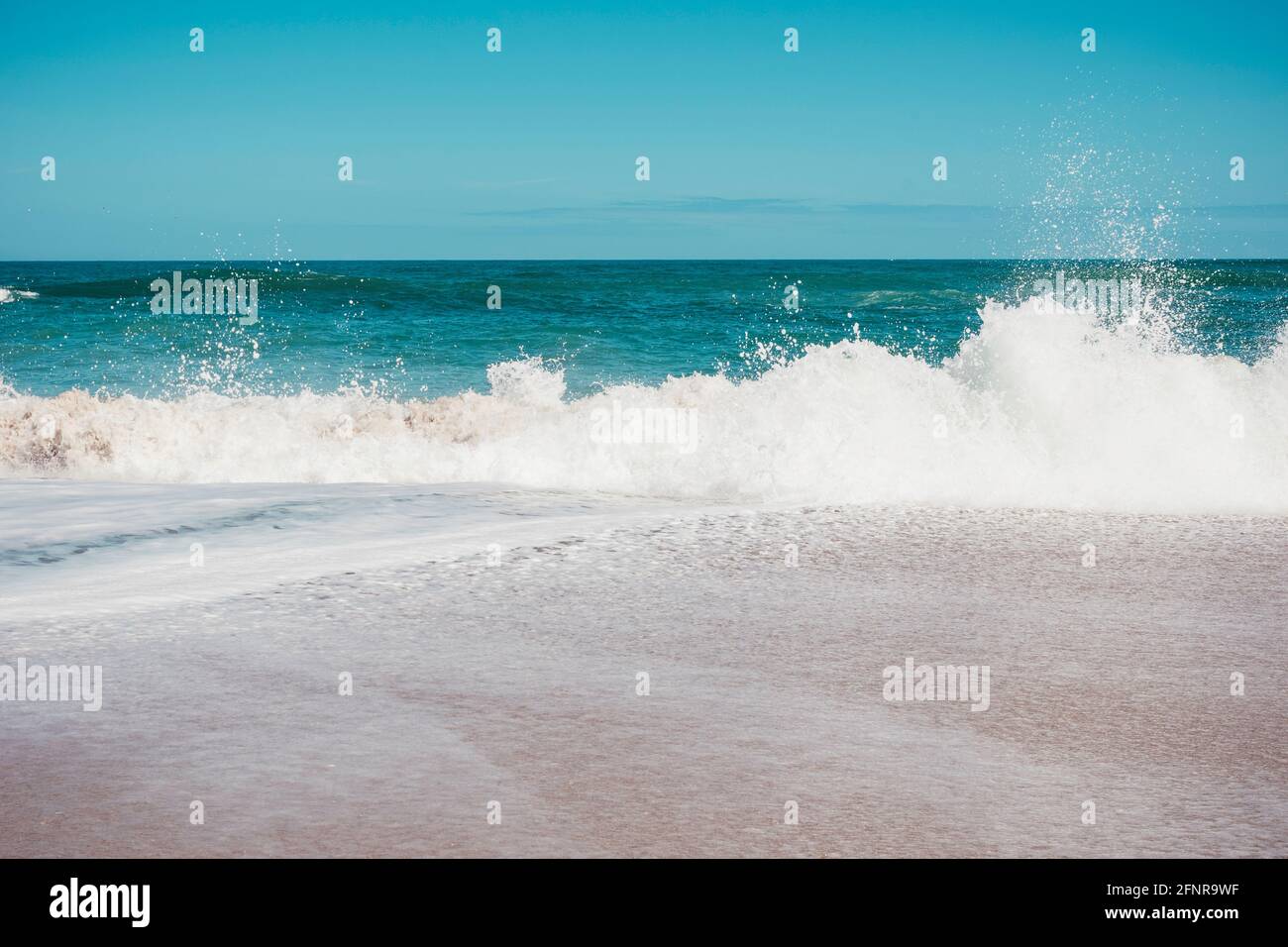 Waves crashing on the shore of Sebastian Inlet in Florida Stock Photo